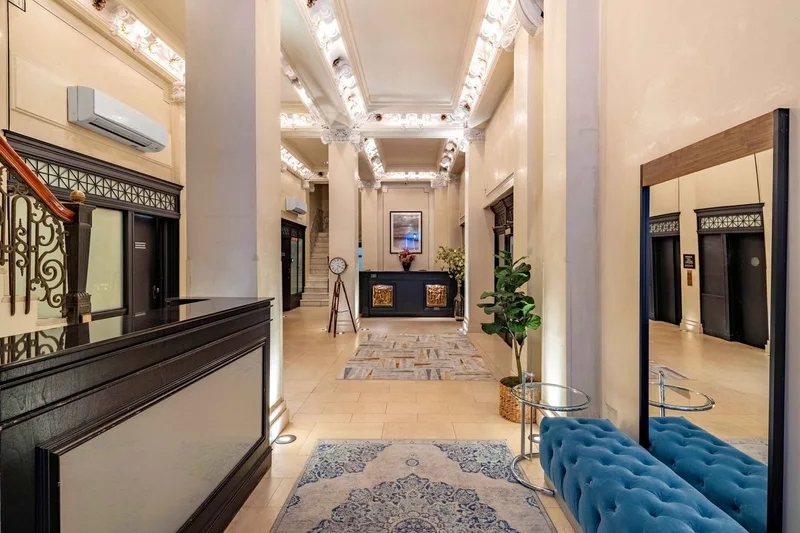 The lobby of The Mansfield, with its coffered ceiling and marble floor